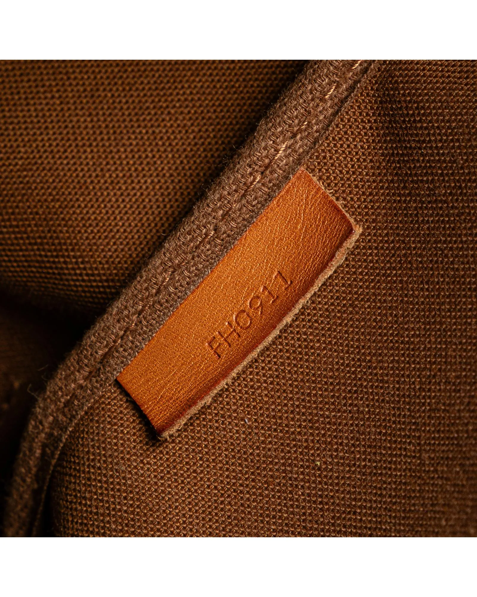 Monogram Saumur Bag with Leather Trim and Buckle Closures