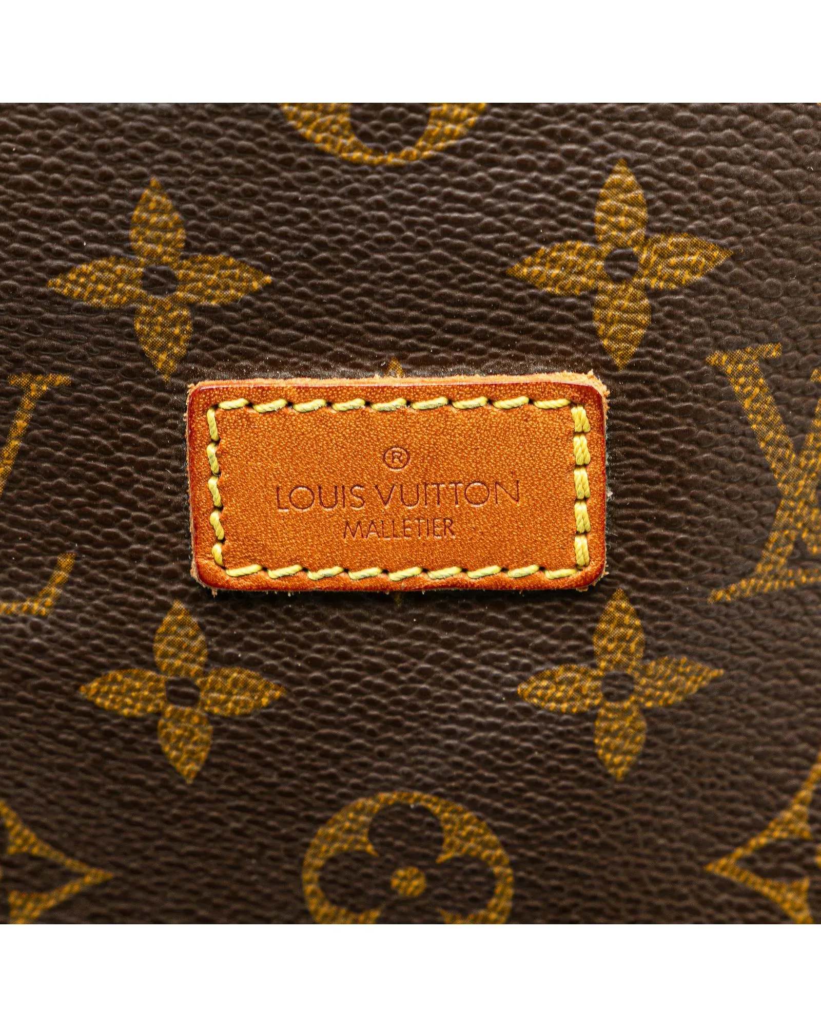 Monogram Saumur Bag with Leather Trim and Buckle Closures