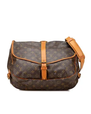 Monogram Saumur Bag with Leather Trim and Buckle Closures