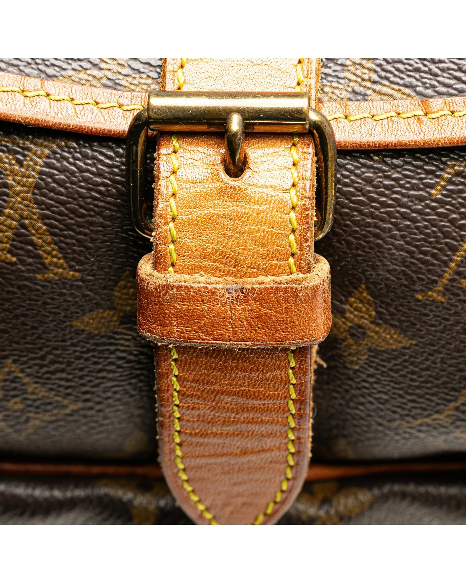 Monogram Saumur Bag with Leather Trim and Buckle Closures