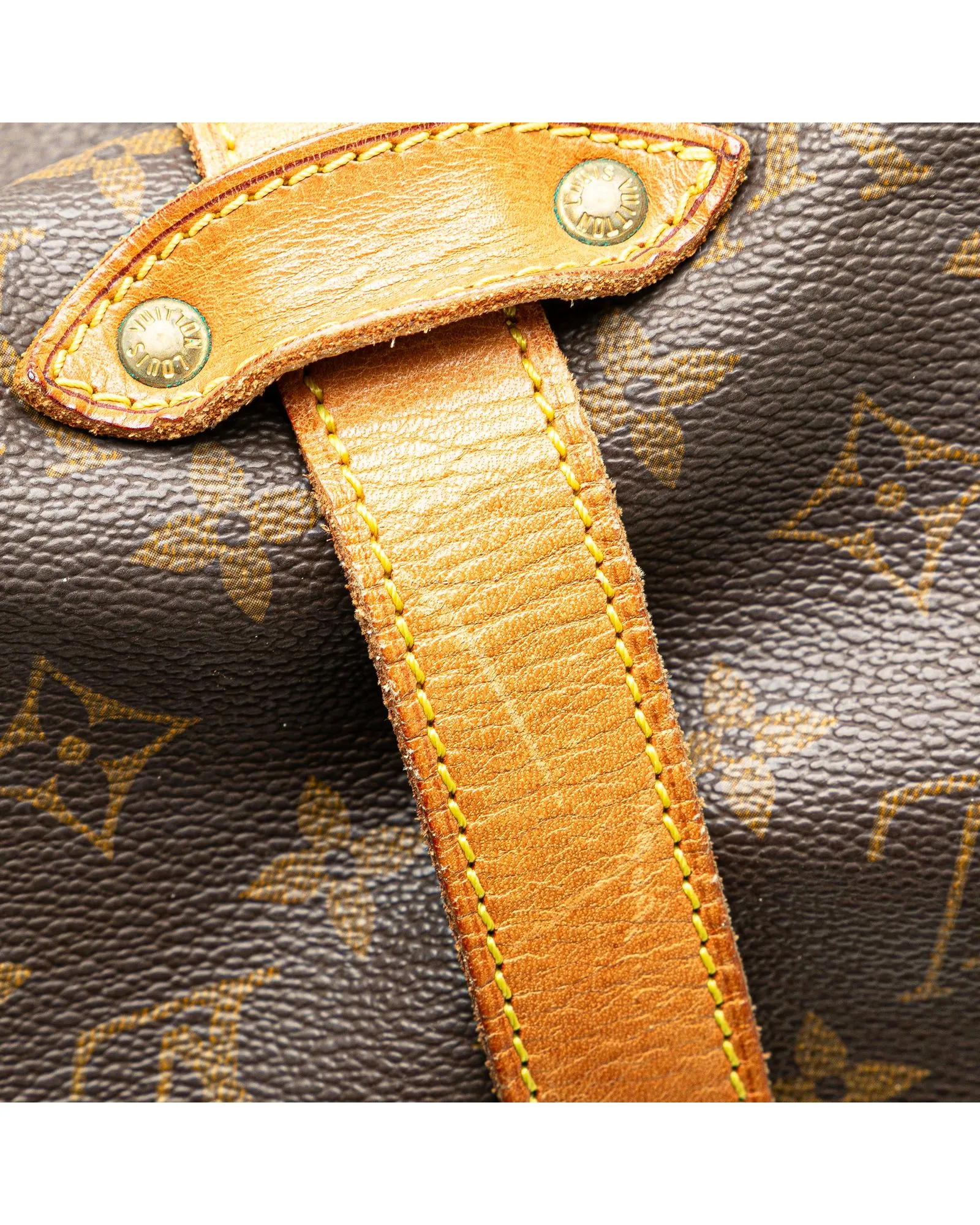 Monogram Saumur Bag with Leather Trim and Buckle Closures