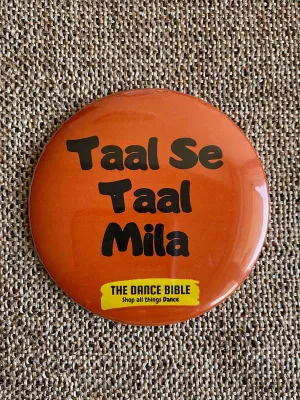 Taal Mila Orange Round Metal Pin Badge